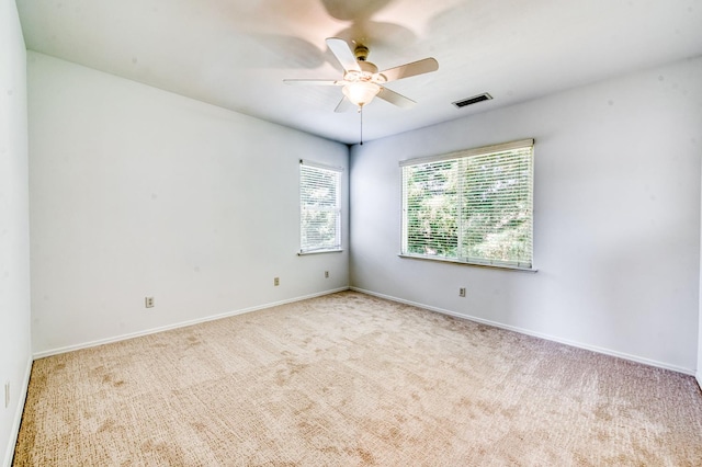 83 W Bohemia Ln, Clovis, CA 93619 - spare room featuring carpet floors, ceiling fan, and baseboards