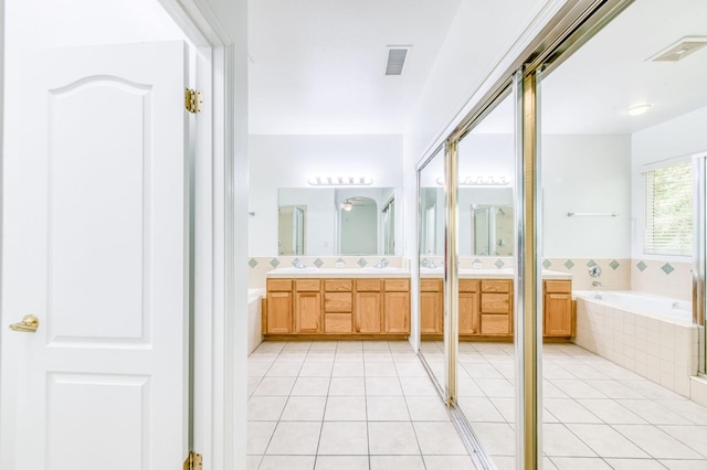 83 W Bohemia Ln, Clovis, CA 93619 - full bath with a garden tub, double vanity, and tile patterned floors
