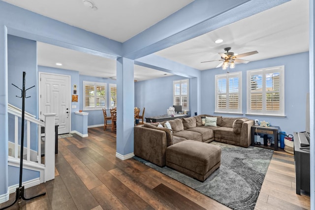 993 Pinewood Ave, Sanger, CA 93657 - living room featuring dark wood-style flooring, ceiling fan, baseboards, stairs, and recessed lighting