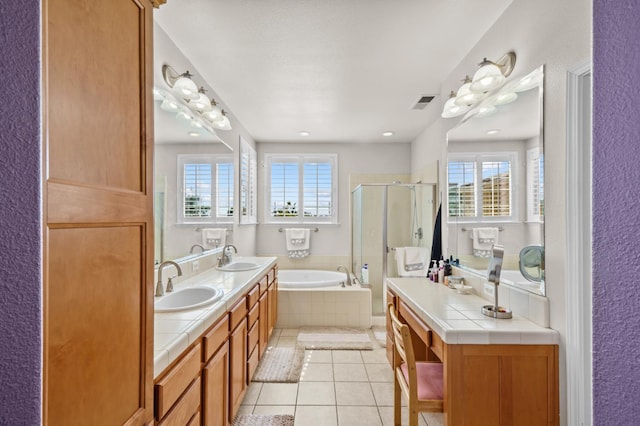 993 Pinewood Ave, Sanger, CA 93657 - bathroom with plenty of natural light, tile patterned flooring, a shower stall, and a garden tub