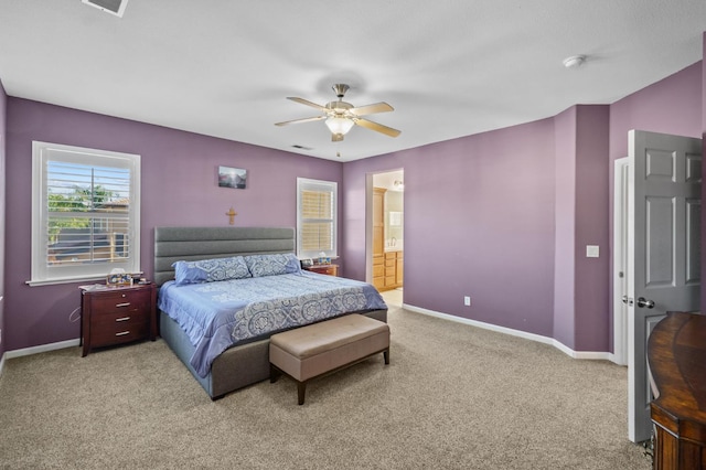 993 Pinewood Ave, Sanger, CA 93657 - bedroom featuring light colored carpet, baseboards, ceiling fan, and ensuite bath