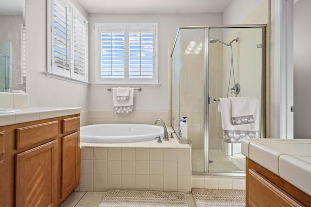 993 Pinewood Ave, Sanger, CA 93657 - bathroom featuring vanity, a stall shower, tile patterned flooring, and a bath