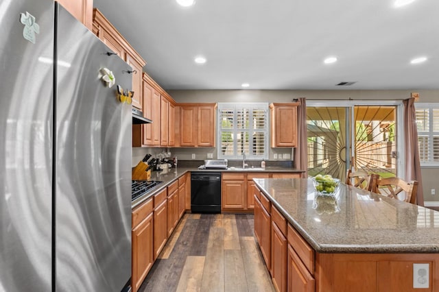 993 Pinewood Ave, Sanger, CA 93657 - kitchen with black appliances, dark wood-style floors, a sink, a center island, and recessed lighting