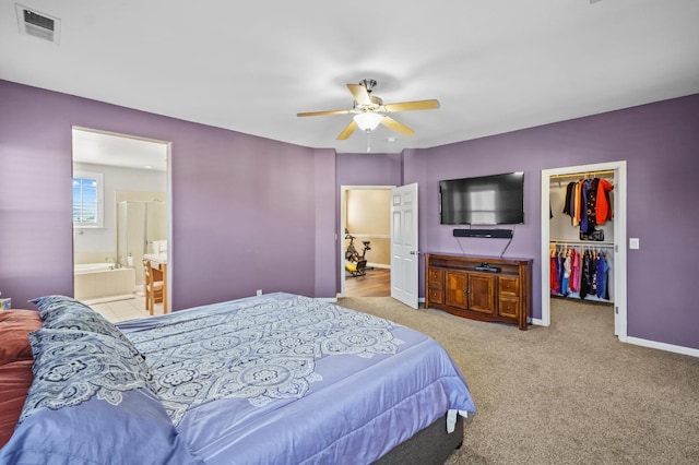 993 Pinewood Ave, Sanger, CA 93657 - carpeted bedroom with a spacious closet, a closet, ceiling fan, ensuite bath, and baseboards