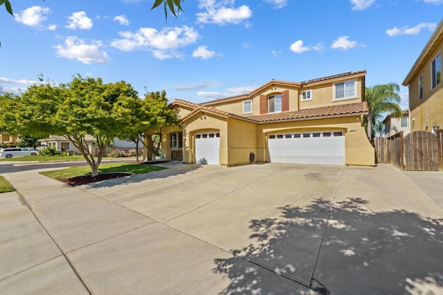 993 Pinewood Ave, Sanger, CA 93657 - mediterranean / spanish house featuring stucco siding, driveway, and a tiled roof