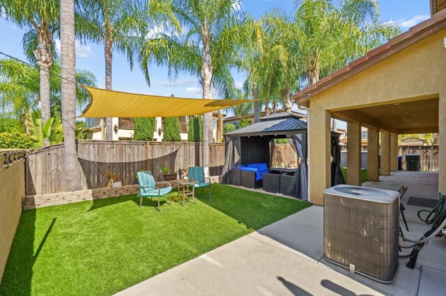 993 Pinewood Ave, Sanger, CA 93657 - view of yard with outdoor lounge area, a gazebo, central AC unit, and a patio area