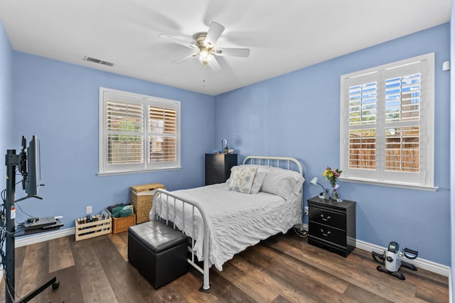 993 Pinewood Ave, Sanger, CA 93657 - bedroom with multiple windows, baseboards, dark wood-style floors, and ceiling fan