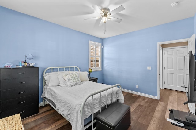 993 Pinewood Ave, Sanger, CA 93657 - bedroom with dark wood-style floors, baseboards, and a ceiling fan