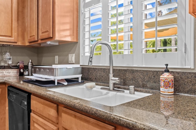 993 Pinewood Ave, Sanger, CA 93657 - kitchen with a sink, black dishwasher, tasteful backsplash, and brown cabinets