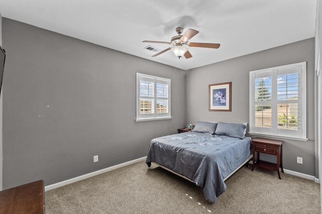 993 Pinewood Ave, Sanger, CA 93657 - carpeted bedroom featuring multiple windows, baseboards, and a ceiling fan