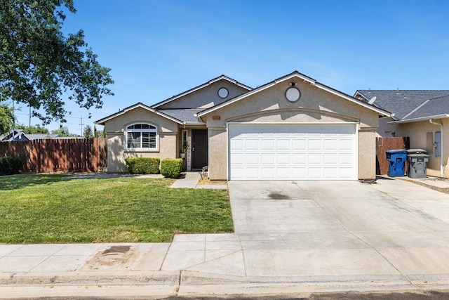 ranch-style home featuring stucco siding, an attached garage, and driveway
