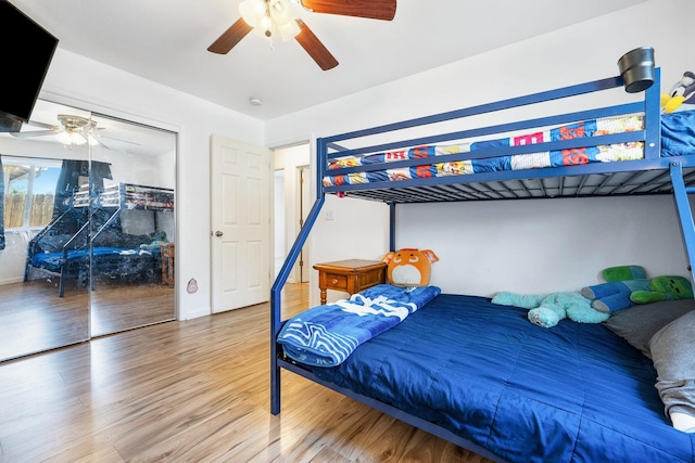 bedroom with wood finished floors and ceiling fan