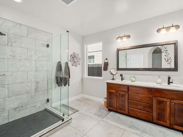 11340 N Via Milano Way, Fresno, CA 93730 - bathroom with a stall shower, double vanity, baseboards, and tile patterned flooring