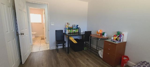 office space featuring dark wood-style floors and baseboards