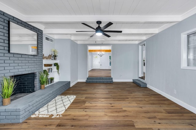 4918 E Illinois Ave, Fresno, CA 93727 - unfurnished living room featuring a brick fireplace, wood finished floors, ceiling fan, baseboards, and wood ceiling with exposed beams