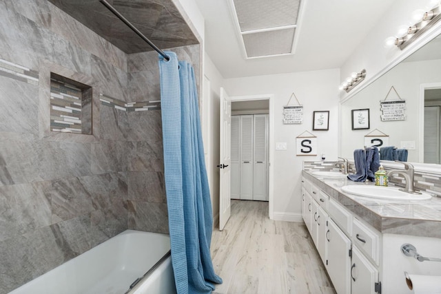 6608 N Haslam Ave, Fresno, CA 93711 - full bath with shower / bath combo, wood finished floors, and double vanity