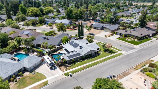 6608 N Haslam Ave, Fresno, CA 93711 - aerial perspective of suburban area featuring a pool area and property parcel outlined