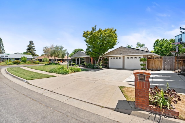 6608 N Haslam Ave, Fresno, CA 93711 - ranch-style home featuring concrete driveway and an attached garage