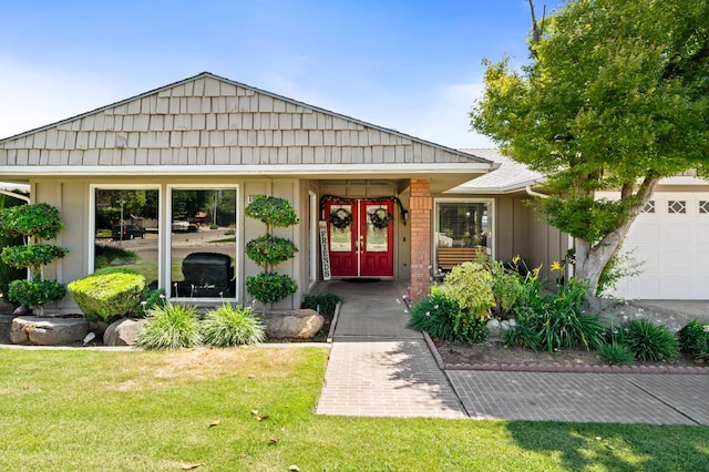 6608 N Haslam Ave, Fresno, CA 93711 - view of front of property featuring french doors, a front lawn, and a garage
