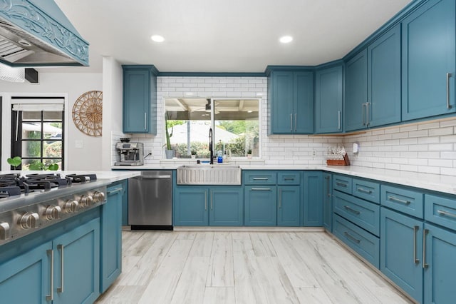 6608 N Haslam Ave, Fresno, CA 93711 - kitchen with a sink, blue cabinetry, plenty of natural light, and recessed lighting