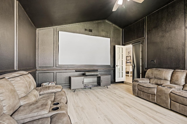 6608 N Haslam Ave, Fresno, CA 93711 - cinema room featuring a decorative wall, light wood finished floors, ceiling fan, and vaulted ceiling