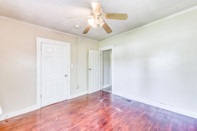 1934 N Vagedes Ave, Fresno, CA 93705 - unfurnished bedroom with wood finished floors, baseboards, crown molding, and ceiling fan