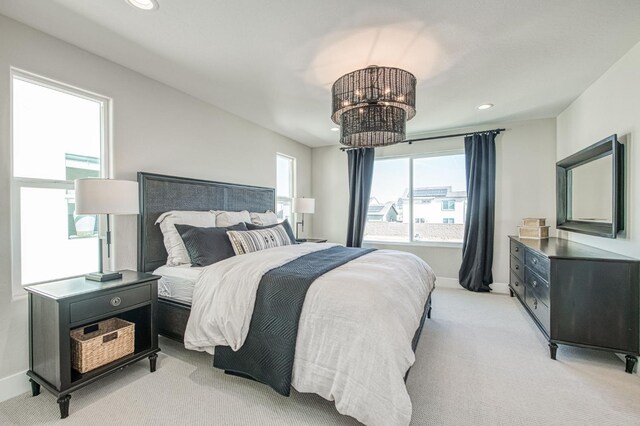 1165 Maclure Ave W, Madera, CA 93636 - bedroom featuring light colored carpet, recessed lighting, a chandelier, and baseboards