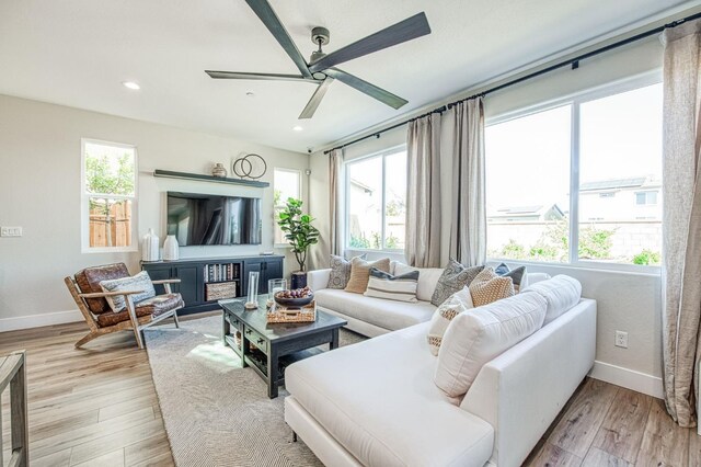 1165 Maclure Ave W, Madera, CA 93636 - living area featuring baseboards, a ceiling fan, light wood-style flooring, and recessed lighting