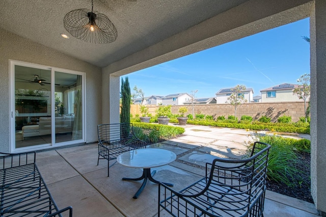 1165 Maclure Ave W, Madera, CA 93636 - fenced backyard featuring a patio area and a residential view