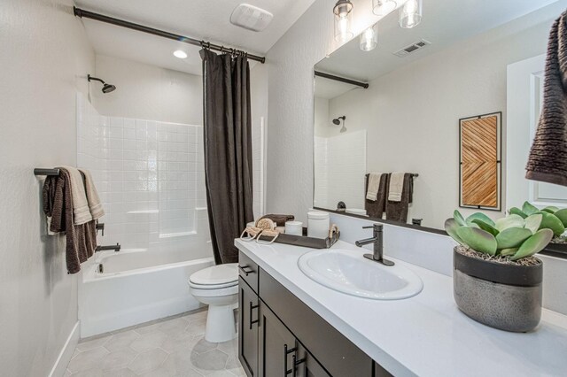 1165 Maclure Ave W, Madera, CA 93636 - bathroom featuring toilet, shower / tub combo with curtain, tile patterned flooring, vanity, and baseboards