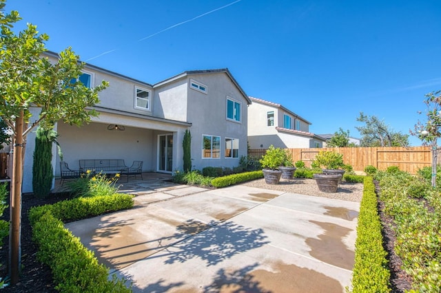 1165 Maclure Ave W, Madera, CA 93636 - rear view of property with a patio and stucco siding