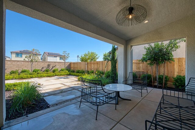 1165 Maclure Ave W, Madera, CA 93636 - fenced backyard with a patio