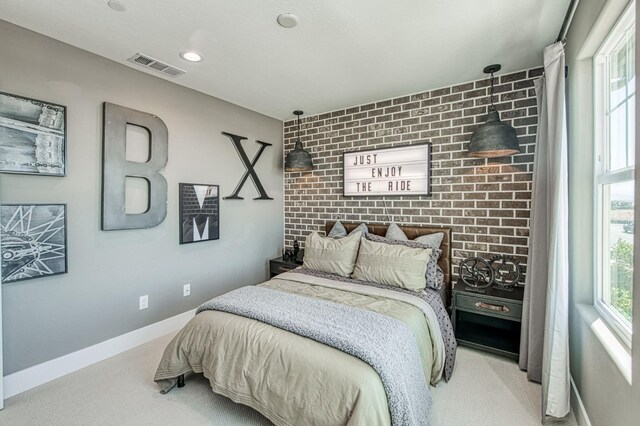 1165 Maclure Ave W, Madera, CA 93636 - carpeted bedroom with baseboards and brick wall