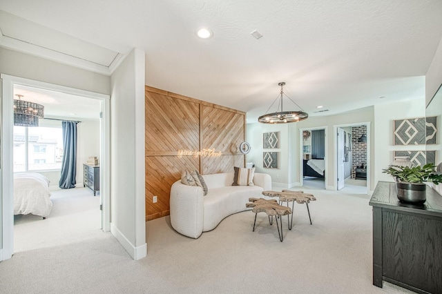 1165 Maclure Ave W, Madera, CA 93636 - carpeted living area with a chandelier, wood walls, baseboards, and recessed lighting