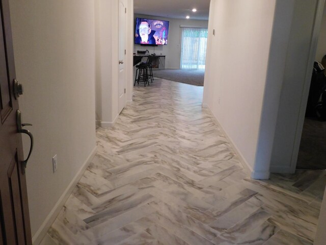865 S Bridle Ave, Fresno, CA 93727 - hallway featuring baseboards and light marble finish floors