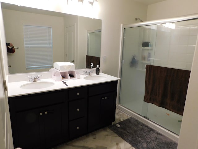 865 S Bridle Ave, Fresno, CA 93727 - bathroom with a stall shower, marble finish floors, and double vanity