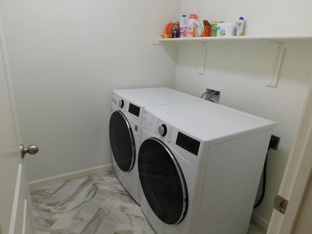 865 S Bridle Ave, Fresno, CA 93727 - laundry area featuring washer and clothes dryer, light marble finish flooring, and baseboards