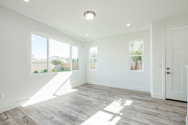 1175 Maclure Ave W, Madera, CA 93636 - empty room featuring light wood-style flooring, baseboards, and recessed lighting