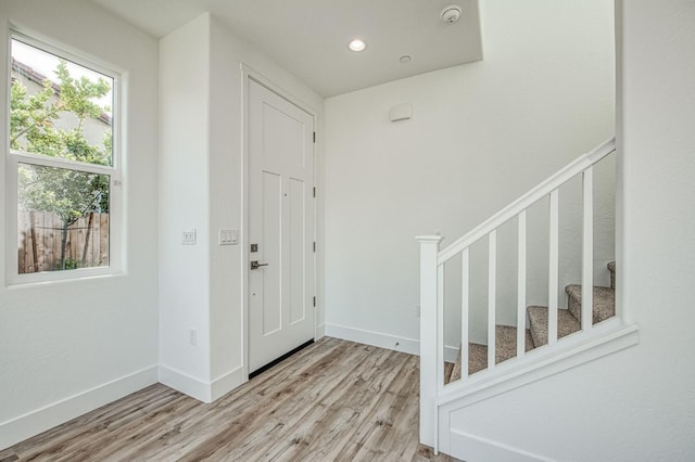 1175 Maclure Ave W, Madera, CA 93636 - entrance foyer featuring wood finished floors, baseboards, stairs, and recessed lighting
