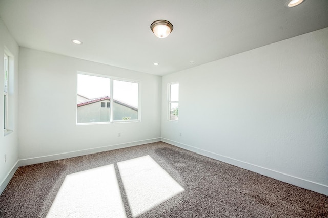 1175 Maclure Ave W, Madera, CA 93636 - empty room featuring carpet floors, recessed lighting, and baseboards