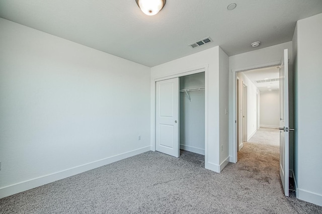 1175 Maclure Ave W, Madera, CA 93636 - unfurnished bedroom featuring carpet, a closet, and baseboards