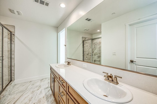 1175 Maclure Ave W, Madera, CA 93636 - full bath featuring a shower stall, marble look tiles, double vanity, recessed lighting, and baseboards