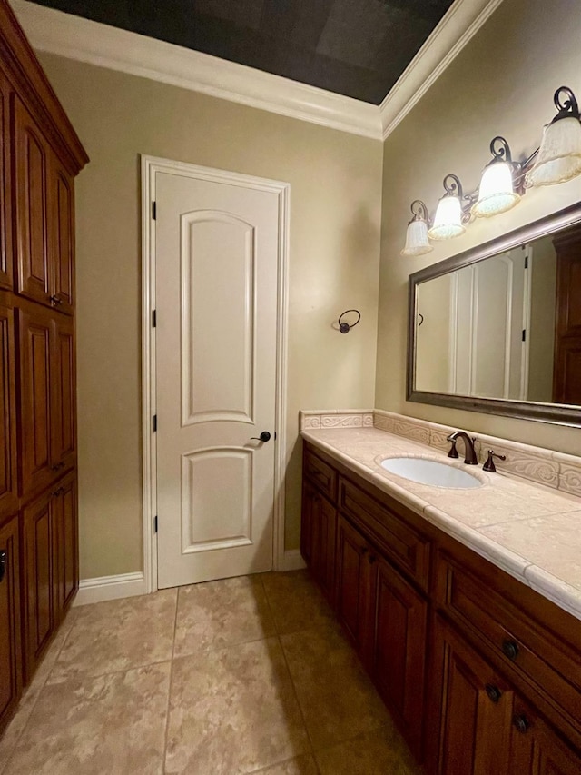 16052 W Middleton Ave, Kerman, CA 93630 - bathroom with crown molding, baseboards, vanity, and tile patterned flooring