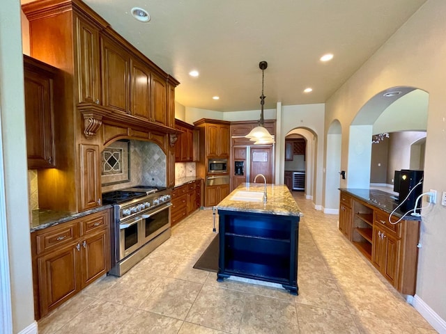 16052 W Middleton Ave, Kerman, CA 93630 - kitchen with appliances with stainless steel finishes, a sink, arched walkways, open shelves, and dark stone countertops