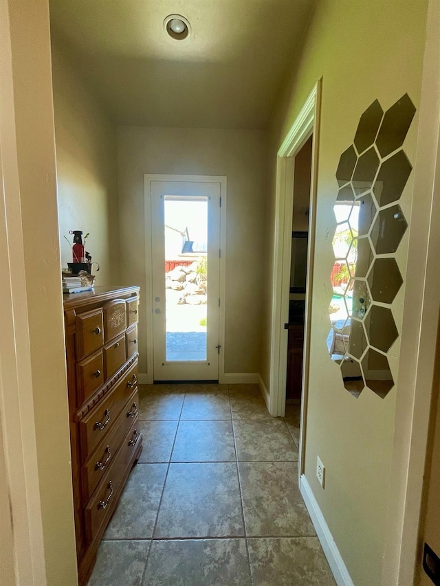 16052 W Middleton Ave, Kerman, CA 93630 - doorway to outside with light tile patterned floors and baseboards