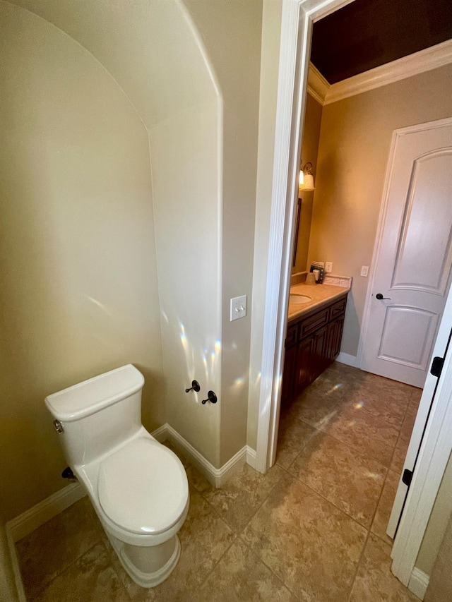 16052 W Middleton Ave, Kerman, CA 93630 - bathroom with ornamental molding, toilet, baseboards, vanity, and tile patterned flooring