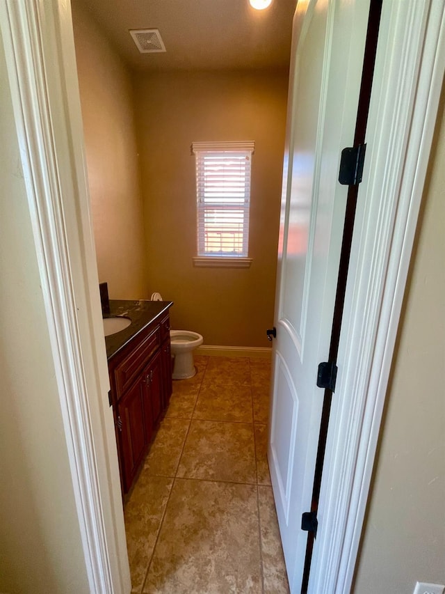 16052 W Middleton Ave, Kerman, CA 93630 - bathroom featuring vanity, toilet, and tile patterned flooring