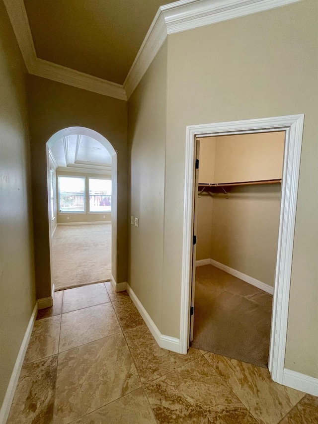 16052 W Middleton Ave, Kerman, CA 93630 - hallway featuring crown molding, arched walkways, carpet floors, and baseboards