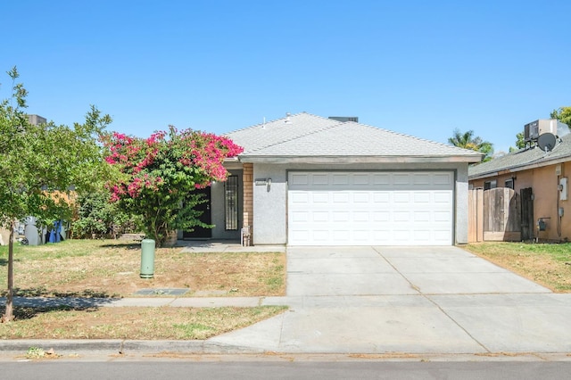 2063 S Tupman Ave, Fresno, CA 93706 - single story home featuring concrete driveway, a garage, and stucco siding