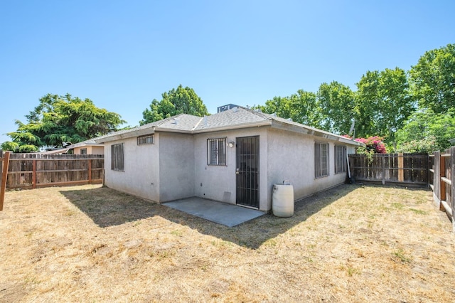 2063 S Tupman Ave, Fresno, CA 93706 - rear view of property with stucco siding and a patio area